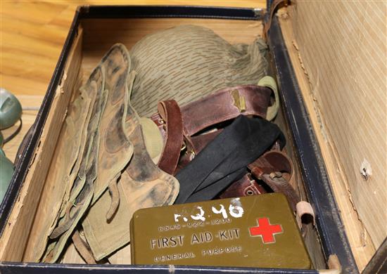 A suitcase containing WWII militaria and helmet